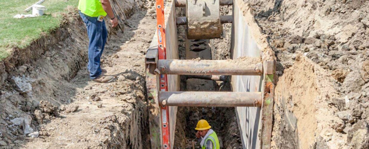 crew working underground in dig site hole at Rochelle Blvd